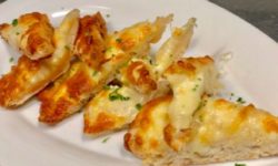Toasted Cheese bread: mozzarella, cheddar and fetta topped with fresh herbs